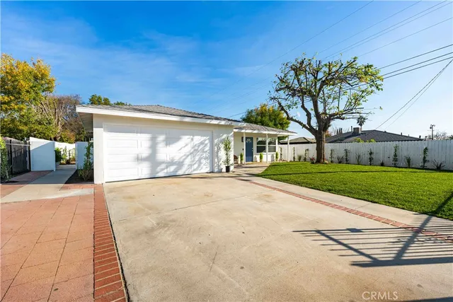 a view of house with yard