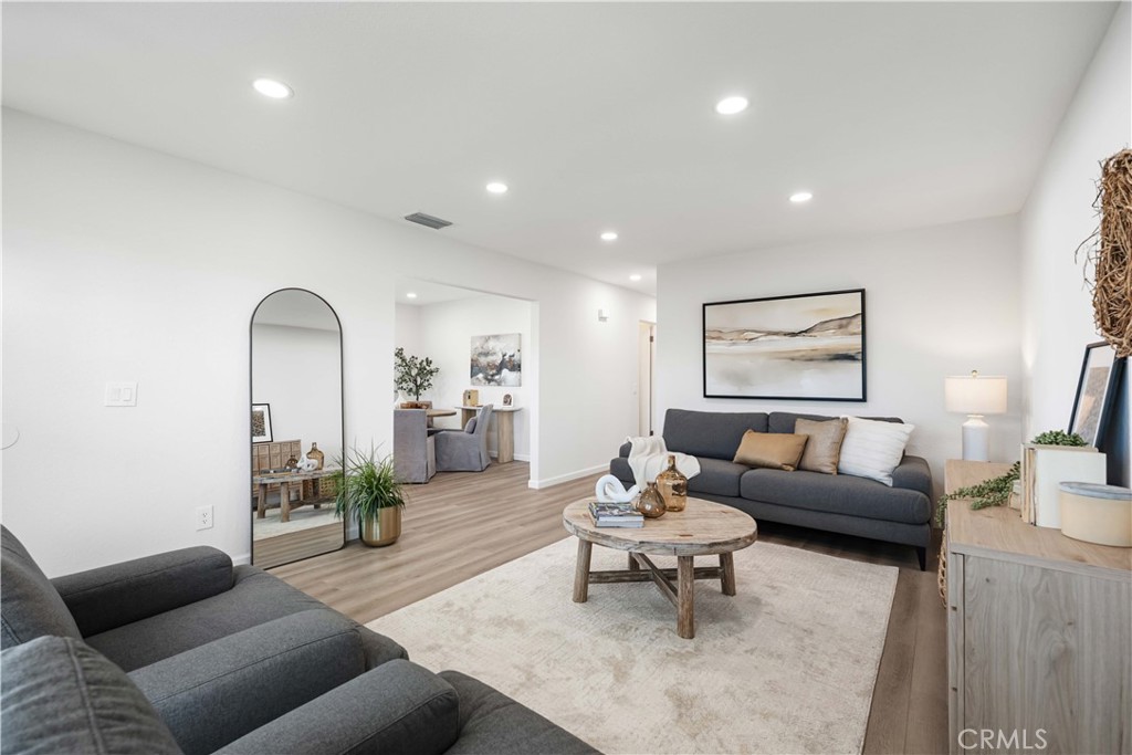 727 North Burney Street Rialto, CA 92376 - Photo 10 of 40 a living room with furniture and wooden floor