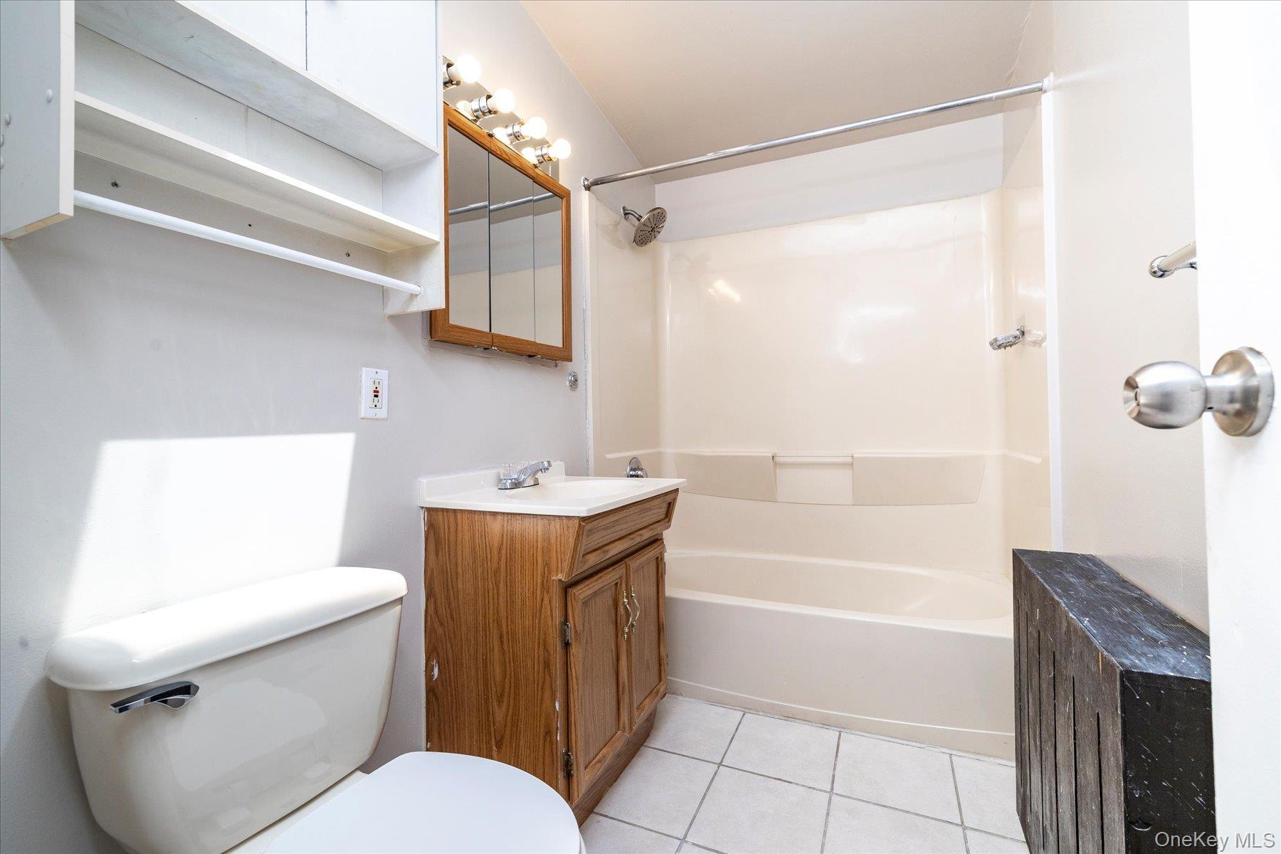 191 Raff Avenue Mineola, NY 11501 - Photo 25 of 25 a bathroom with a sink a toilet and shower