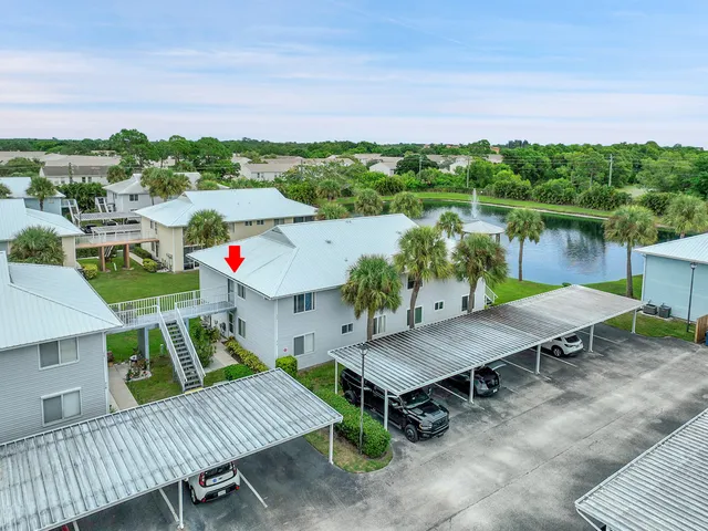 a view of a balcony with two chairs and a table
