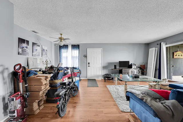a view of a livingroom with workspace and a couch