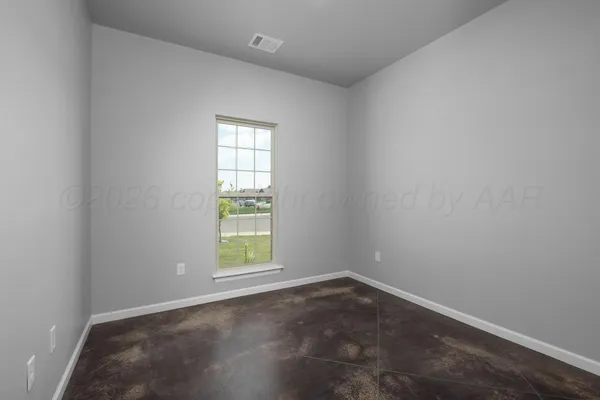 an empty room with closet area