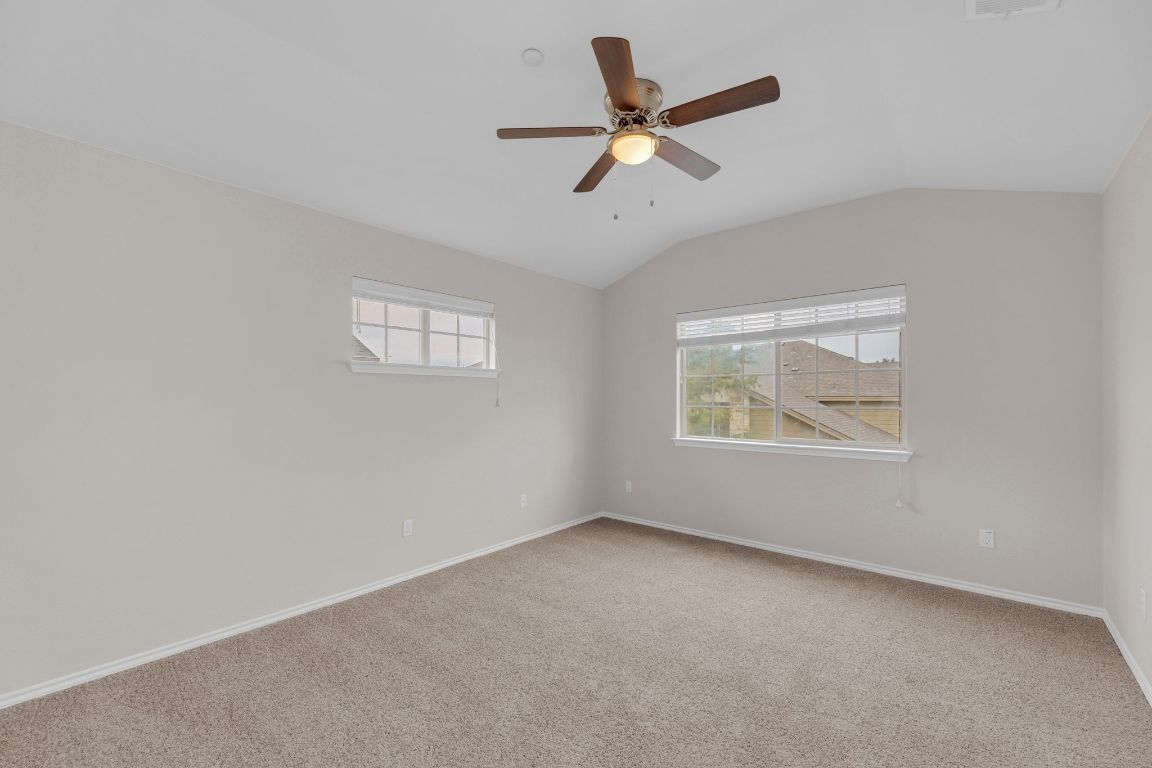 14815 Avery Ranch Boulevard, Unit 403/4B Austin, TX 78717 - Photo 15 of 38 an empty room with a window and a ceiling fan