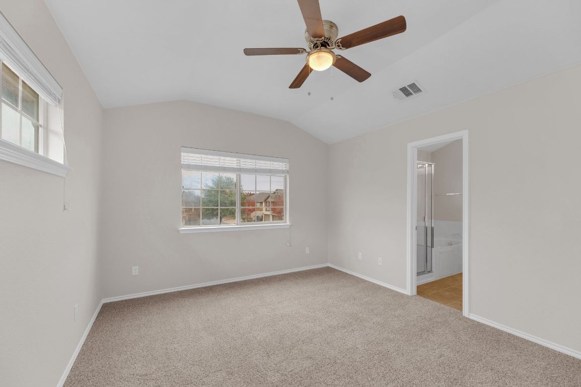 14815 Avery Ranch Boulevard, Unit 403/4B Austin, TX 78717 - Photo 16 of 38 an empty room with a window and a fan