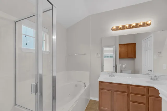 a bathroom with a bathtub and a sink