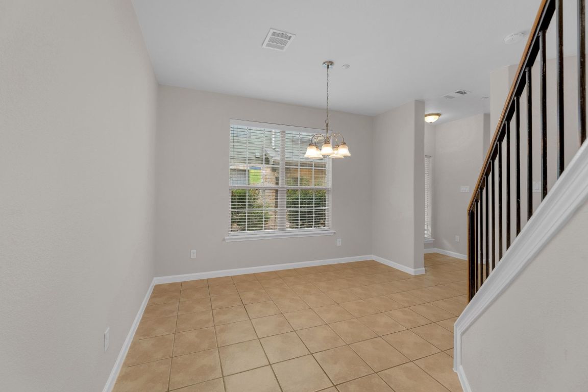 14815 Avery Ranch Boulevard, Unit 403/4B Austin, TX 78717 - Photo 25 of 38 a view of an empty room with glass door
