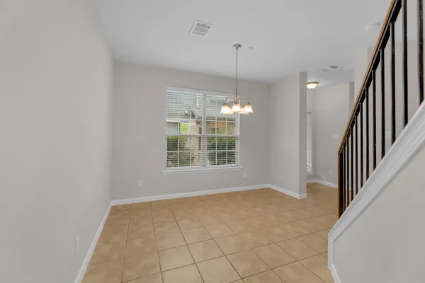 a view of an empty room with glass door