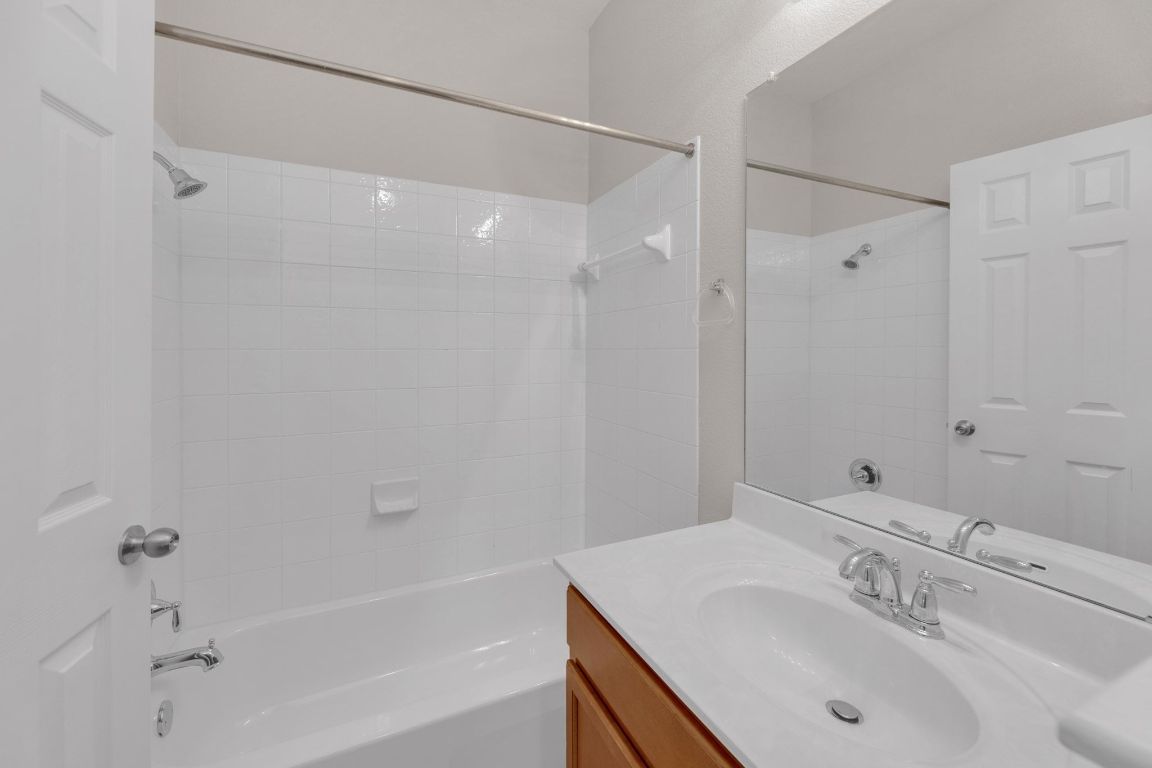 14815 Avery Ranch Boulevard, Unit 403/4B Austin, TX 78717 - Photo 29 of 38 a bathroom with a sink shower and a mirror