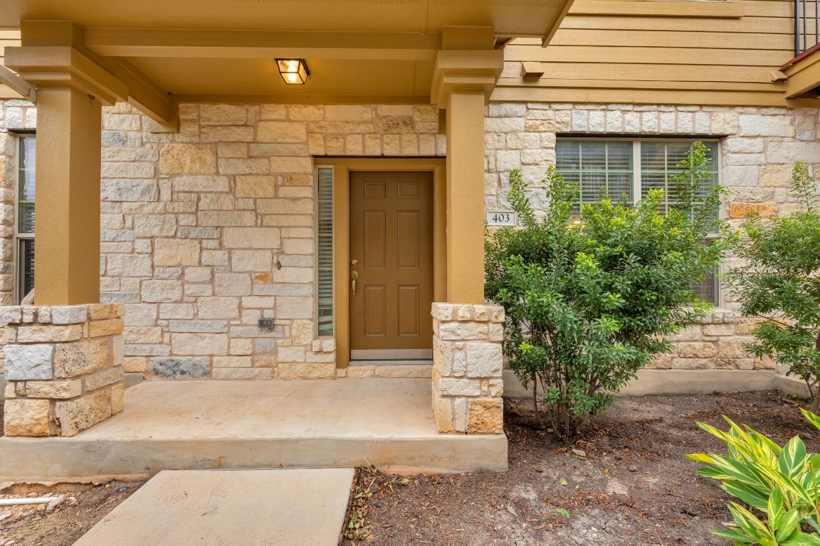 14815 Avery Ranch Boulevard, Unit 403/4B Austin, TX 78717 - Photo 4 of 38 a front view of a house with a garden