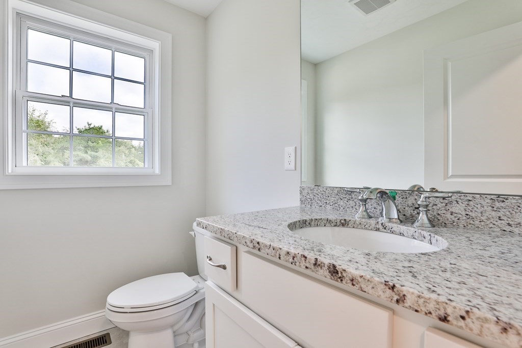 492 Northfield Road Lunenburg, MA 01462 - Photo 12 of 39 a bathroom with a granite countertop sink toilet and mirror