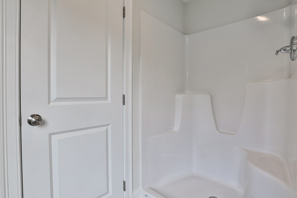 492 Northfield Road Lunenburg, MA 01462 - Photo 26 of 39 a bathroom with a glass shower door
