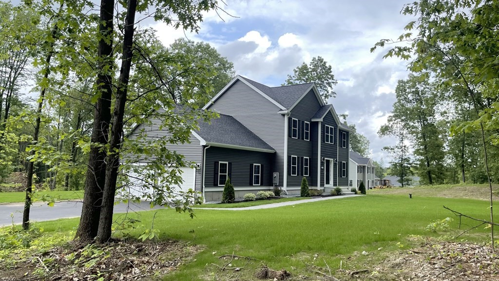 492 Northfield Road Lunenburg, MA 01462 - Photo 31 of 39 a view of a house with backyard and a tree