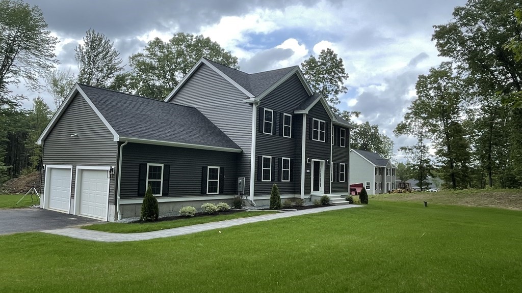 492 Northfield Road Lunenburg, MA 01462 - Photo 32 of 39 a view of a house with a yard and large tree