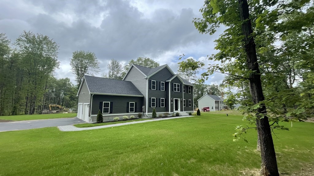 492 Northfield Road Lunenburg, MA 01462 - Photo 33 of 39 a front view of a house with a yard