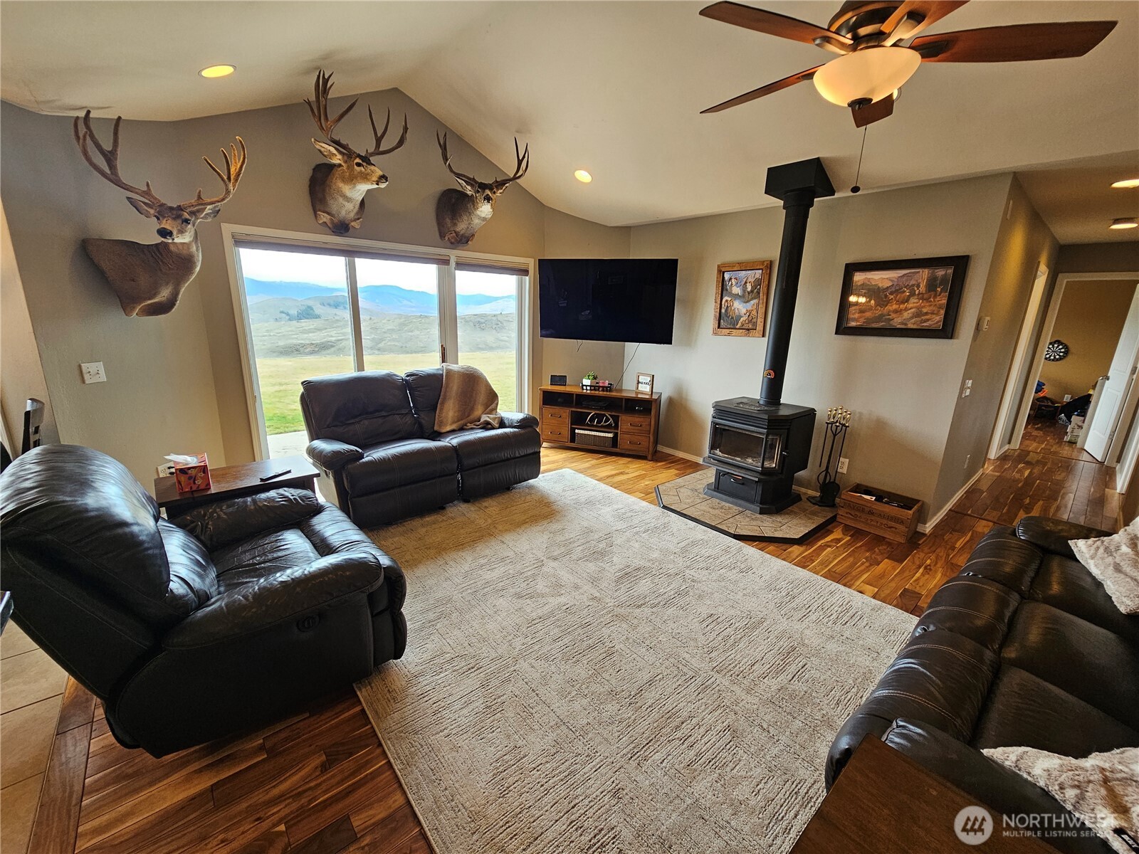711 Havillah Road Tonasket, WA 98855 - Photo 12 of 40 a living room with furniture and a flat screen tv