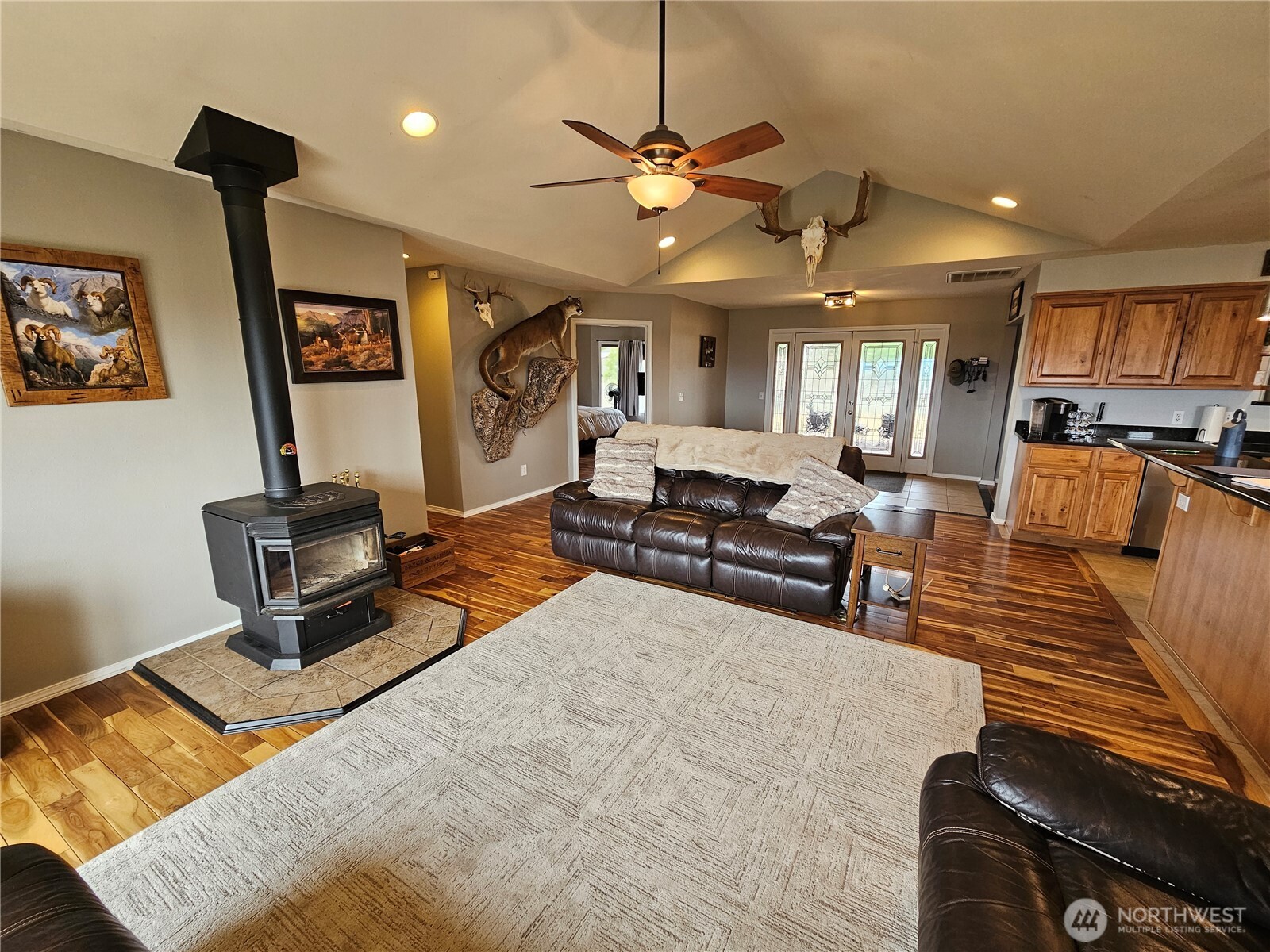 711 Havillah Road Tonasket, WA 98855 - Photo 13 of 40 a living room with furniture and a chandelier