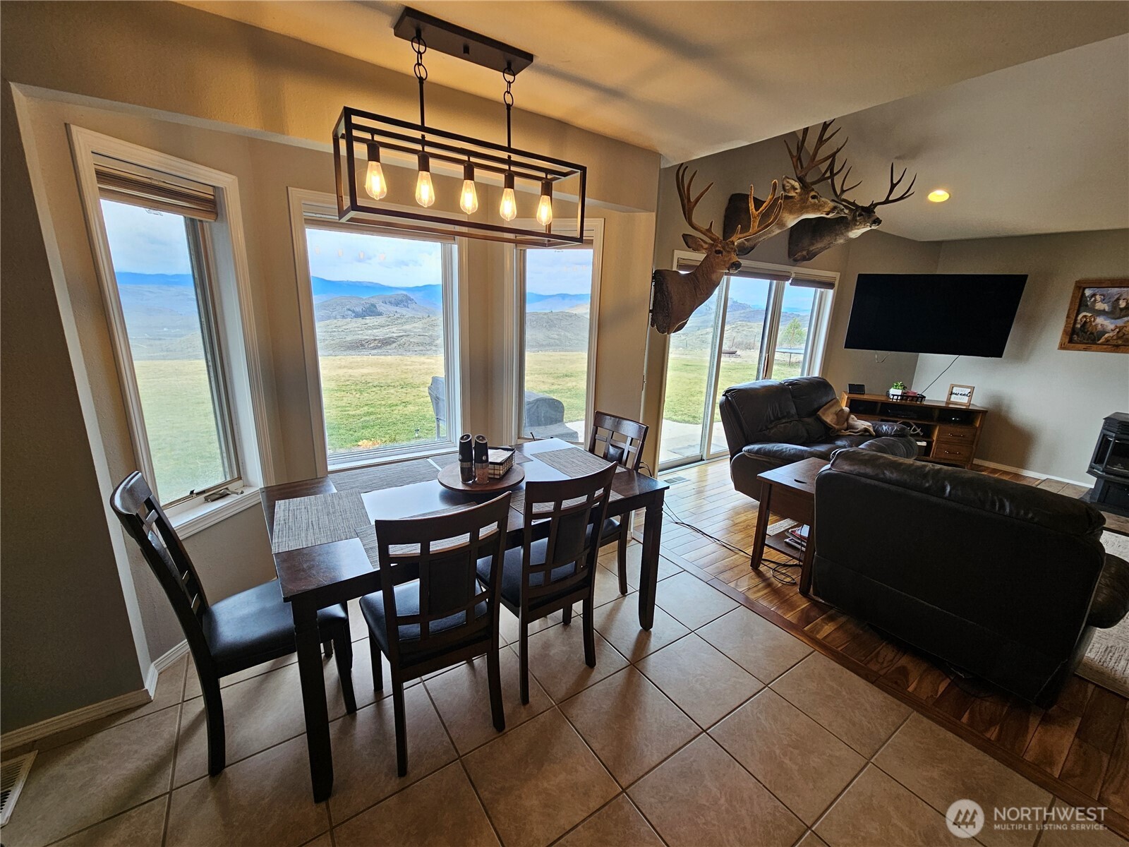 711 Havillah Road Tonasket, WA 98855 - Photo 15 of 40 a view of a dining room with furniture window and outside view