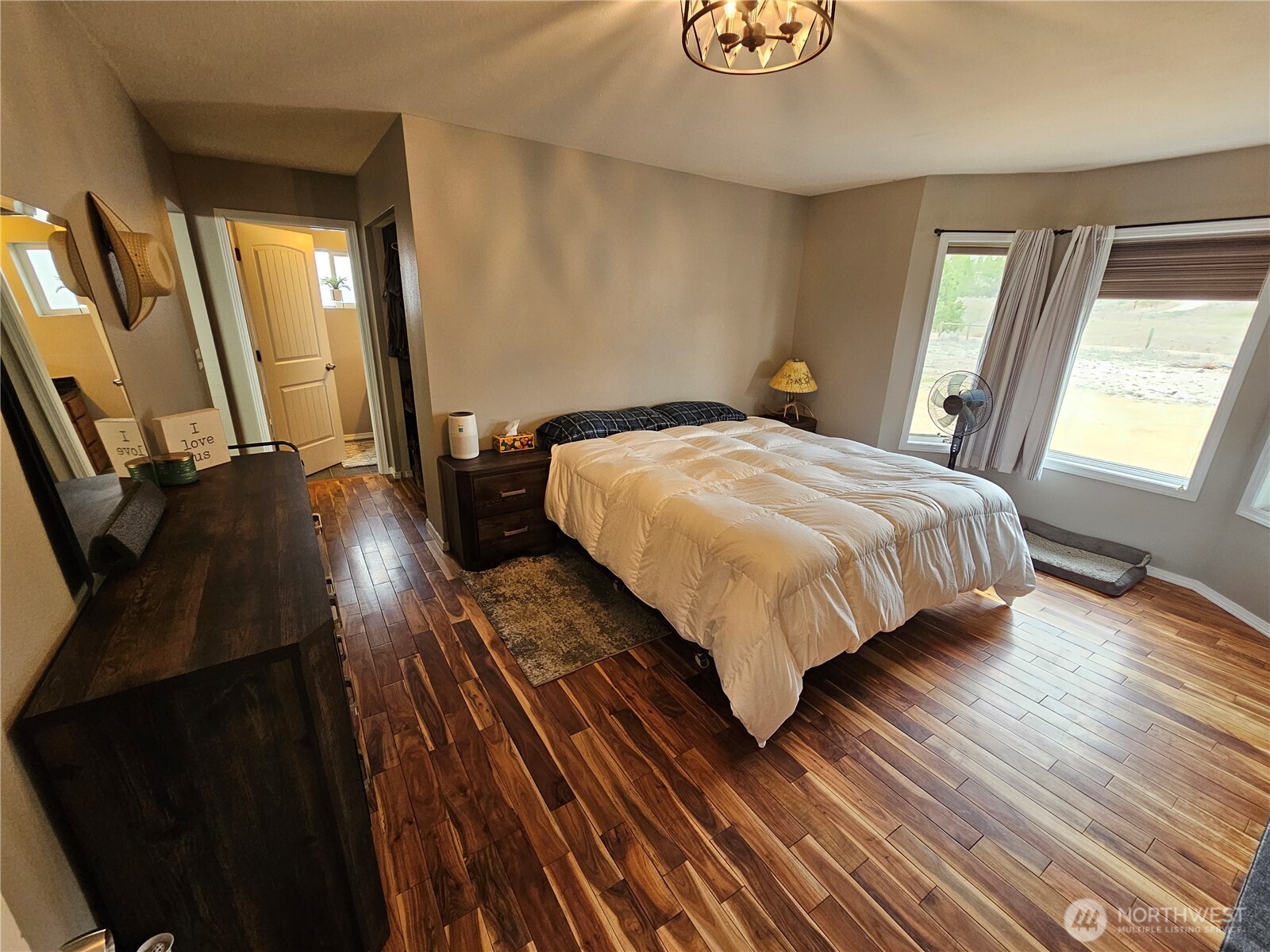 711 Havillah Road Tonasket, WA 98855 - Photo 16 of 40 a bedroom with a bed and wooden floor