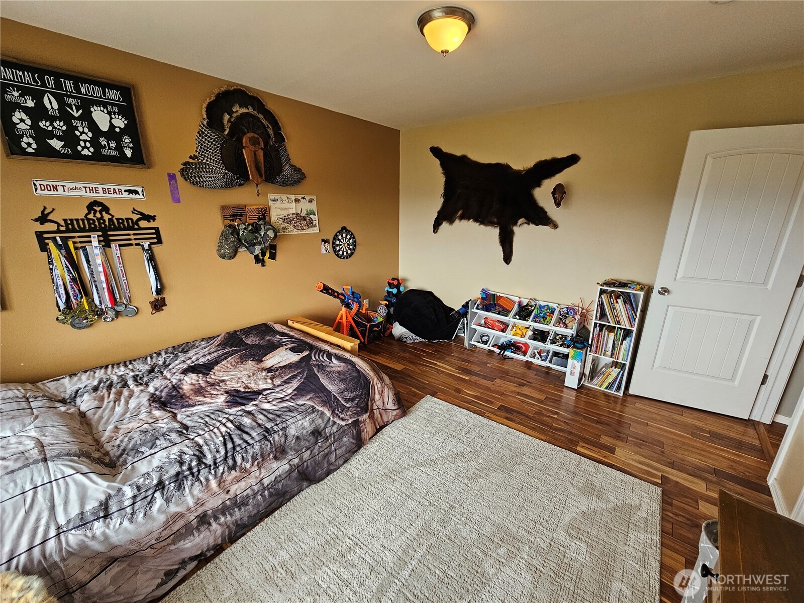 711 Havillah Road Tonasket, WA 98855 - Photo 21 of 40 a bedroom with a bed and wooden floor