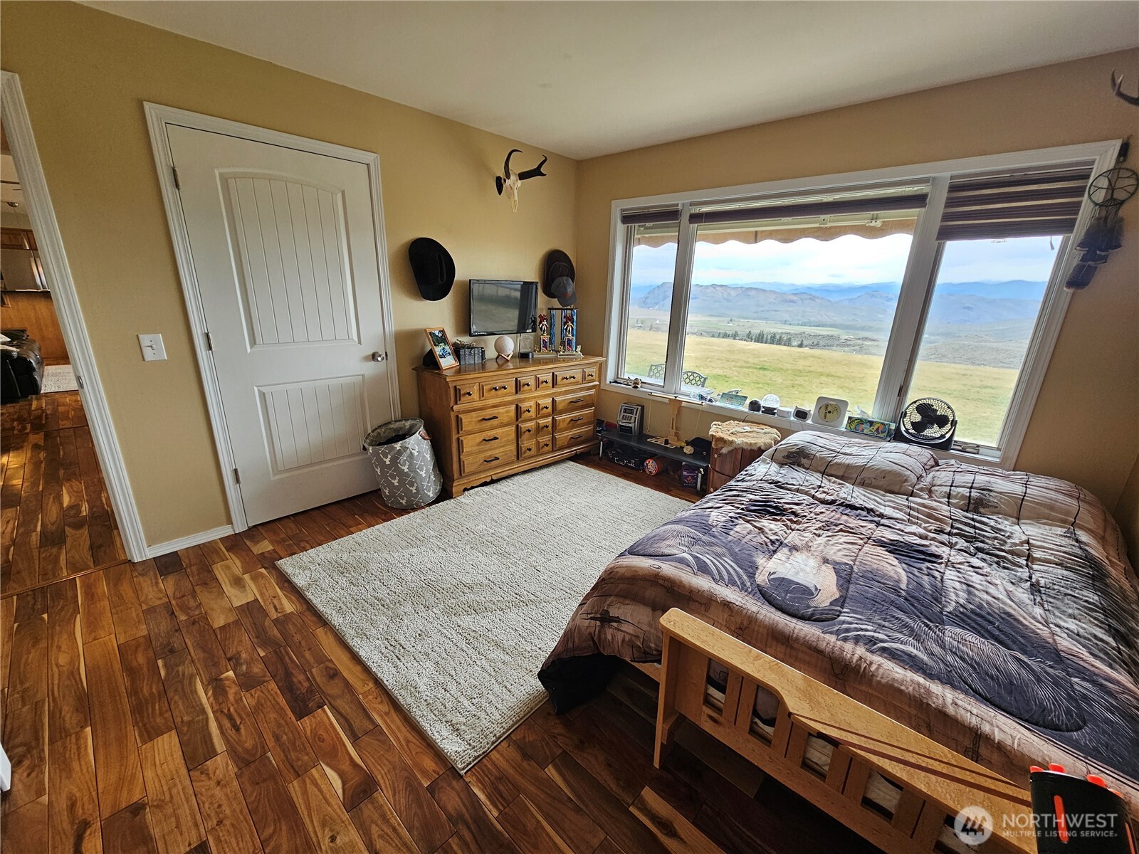 711 Havillah Road Tonasket, WA 98855 - Photo 22 of 40 a bed sitting in a bedroom next to a window