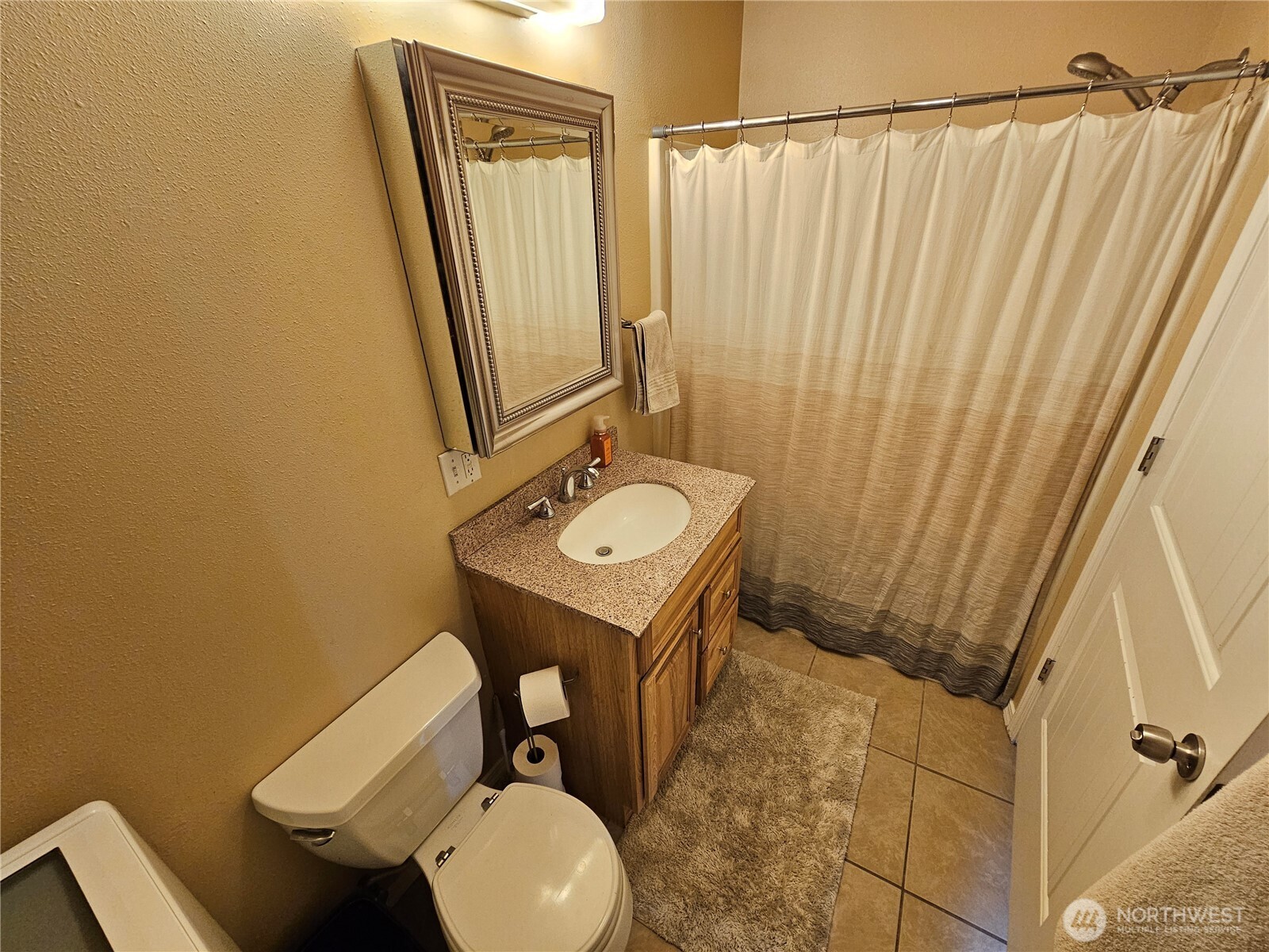 711 Havillah Road Tonasket, WA 98855 - Photo 26 of 40 a bathroom with a sink toilet and shower