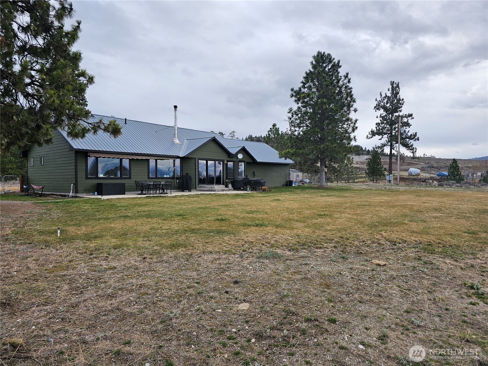 711 Havillah Road Tonasket, WA 98855 - Photo 29 of 40 a front view of a house with garden