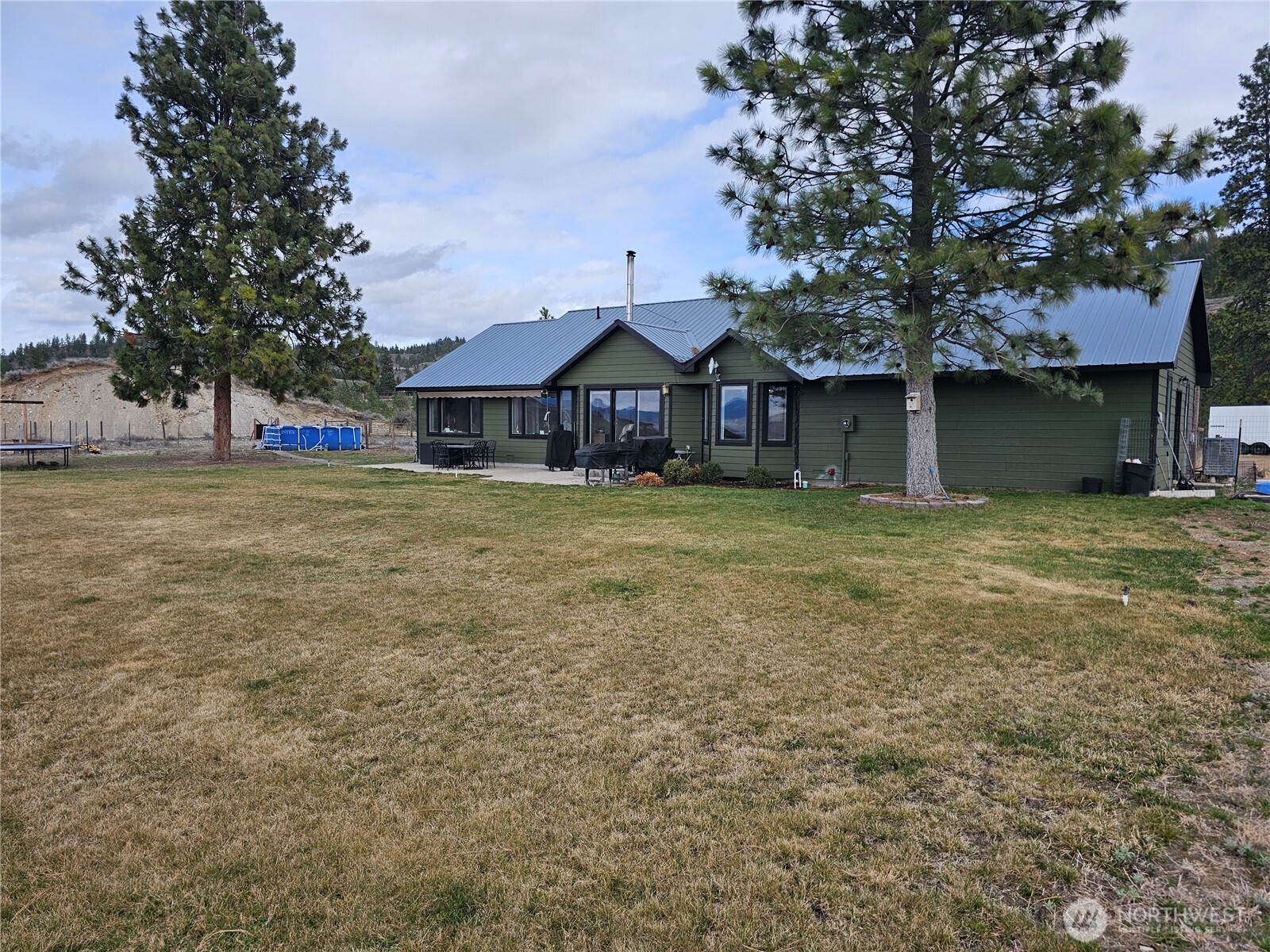 711 Havillah Road Tonasket, WA 98855 - Photo 30 of 40 a front view of a house with a yard