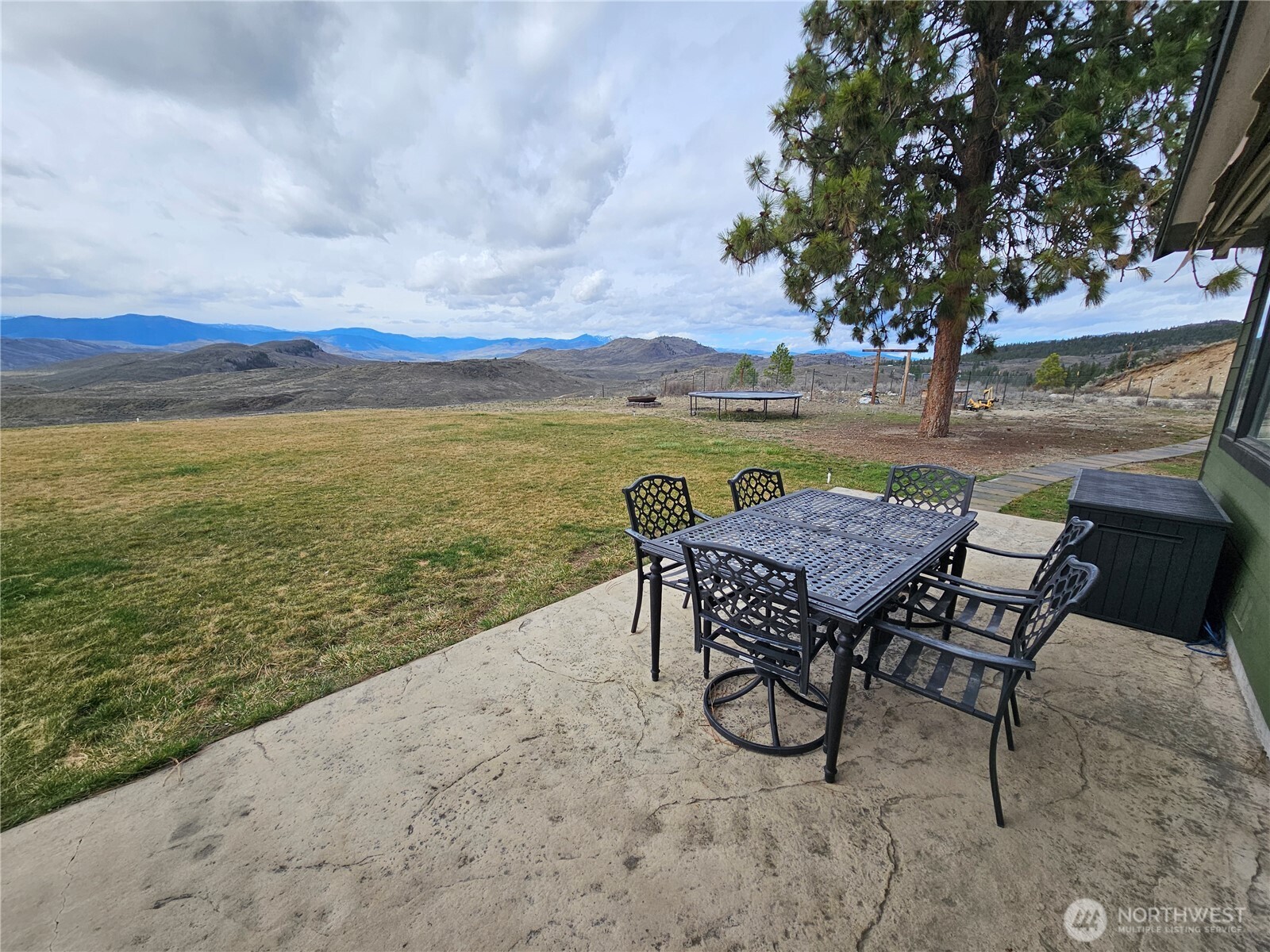 711 Havillah Road Tonasket, WA 98855 - Photo 32 of 40 a view of a lake with furniture