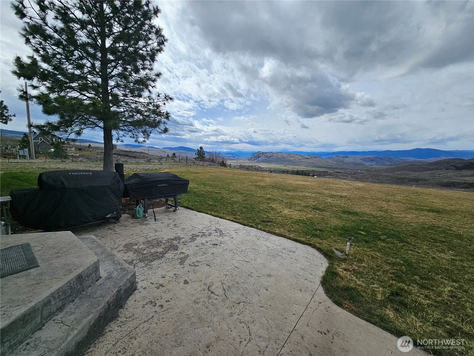 711 Havillah Road Tonasket, WA 98855 - Photo 33 of 40 a view of a lake with a big yard and potted plants