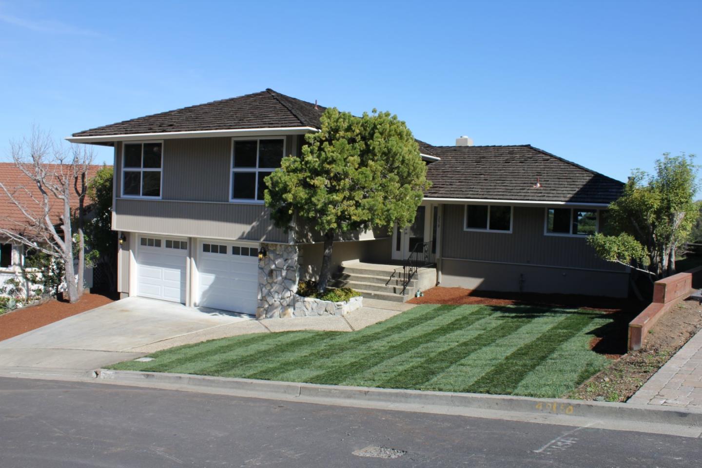 250 Loma Road San Carlos, CA 94070 - Photo 1 of 25 a front view of a house with a yard