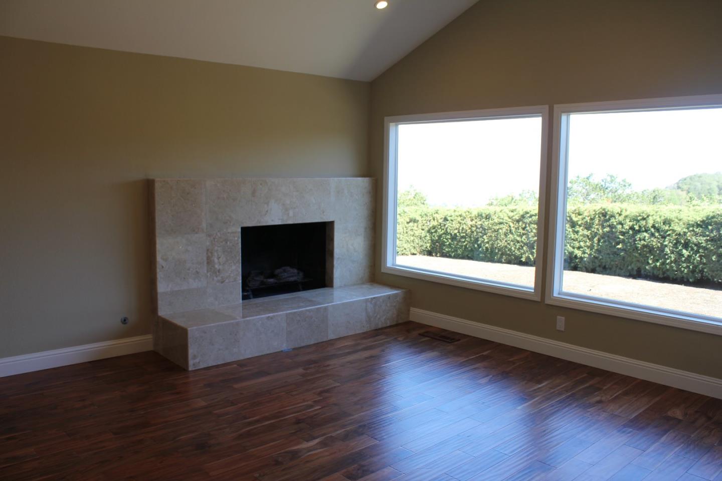 250 Loma Road San Carlos, CA 94070 - Photo 11 of 25 a living room with wooden floor and a fireplace