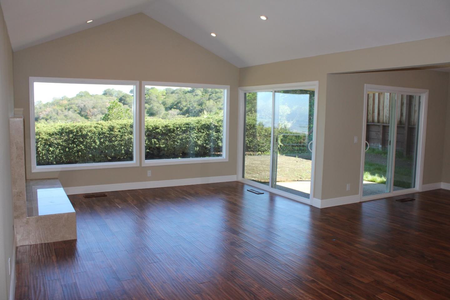 250 Loma Road San Carlos, CA 94070 - Photo 12 of 25 a view of room with wooden floor and large window