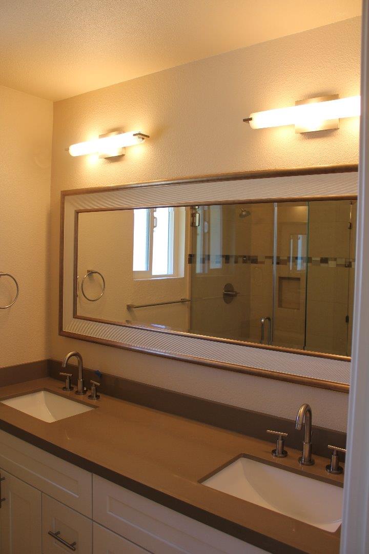 250 Loma Road San Carlos, CA 94070 - Photo 14 of 25 a bathroom with a sink and a mirror
