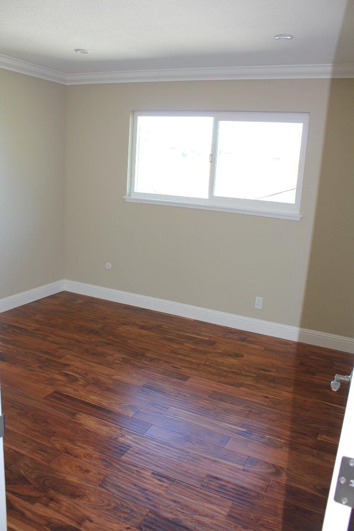 250 Loma Road San Carlos, CA 94070 - Photo 17 of 25 a view of an empty room with wooden floor and a window