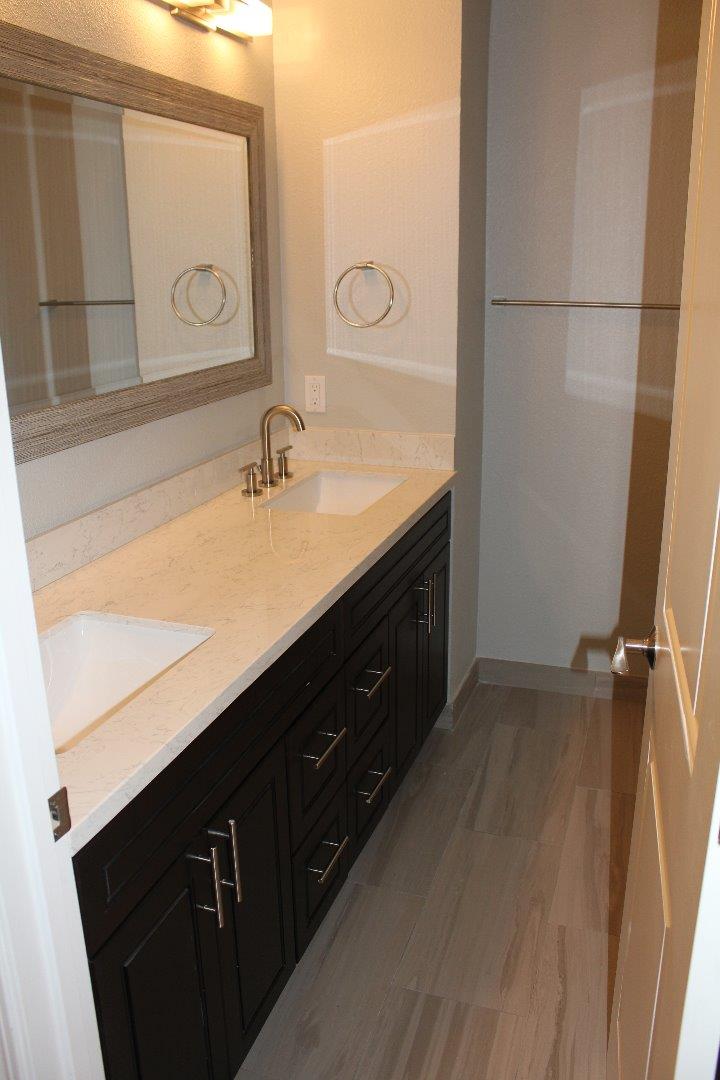 250 Loma Road San Carlos, CA 94070 - Photo 18 of 25 a bathroom with a sink and a mirror