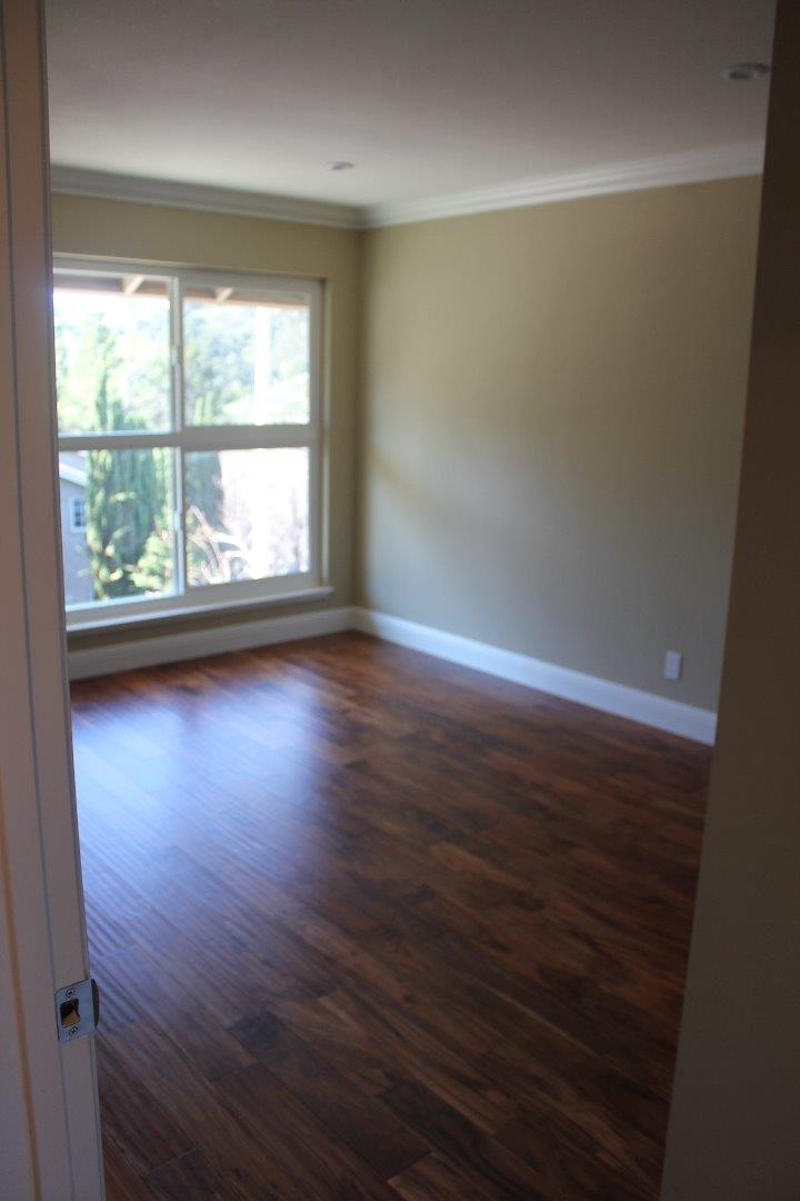 250 Loma Road San Carlos, CA 94070 - Photo 21 of 25 an empty room with wooden floor and windows