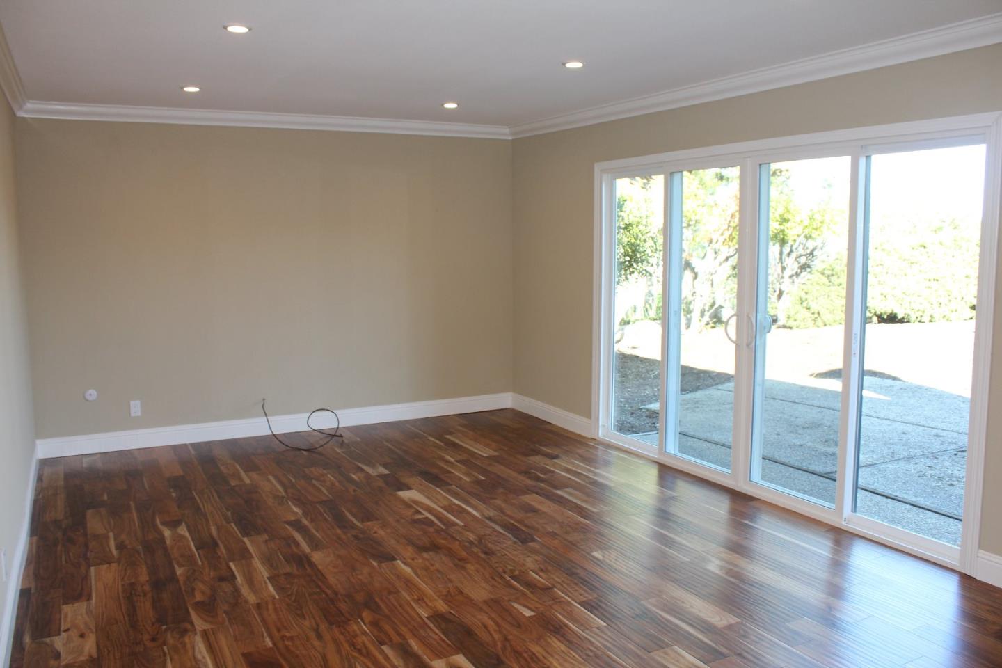 250 Loma Road San Carlos, CA 94070 - Photo 24 of 25 a view of an empty room with wooden floor and a window