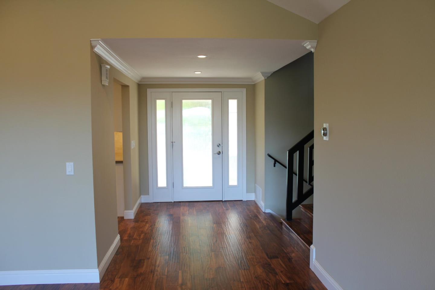 250 Loma Road San Carlos, CA 94070 - Photo 4 of 25 a view of hallway with wooden floor and stairs