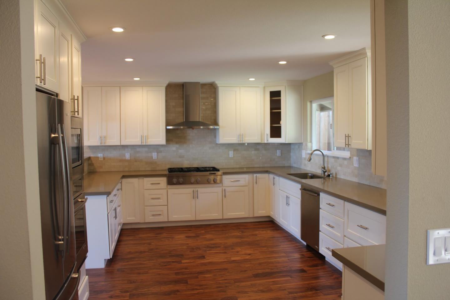 250 Loma Road San Carlos, CA 94070 - Photo 6 of 25 a kitchen with stainless steel appliances granite countertop a sink stove and refrigerator