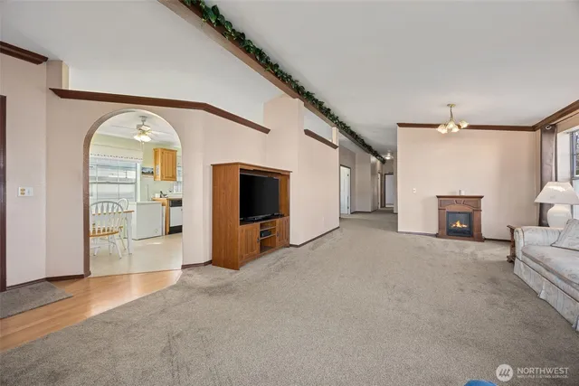a view of a livingroom with furniture and a fireplace