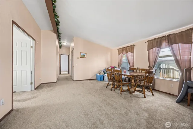 a view of a livingroom with furniture and window