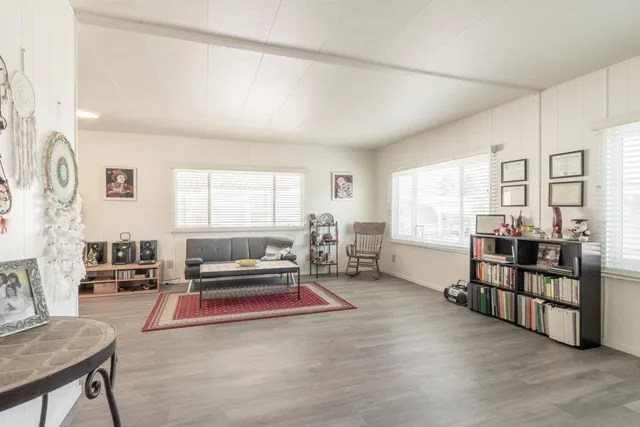 a living room with furniture and a table