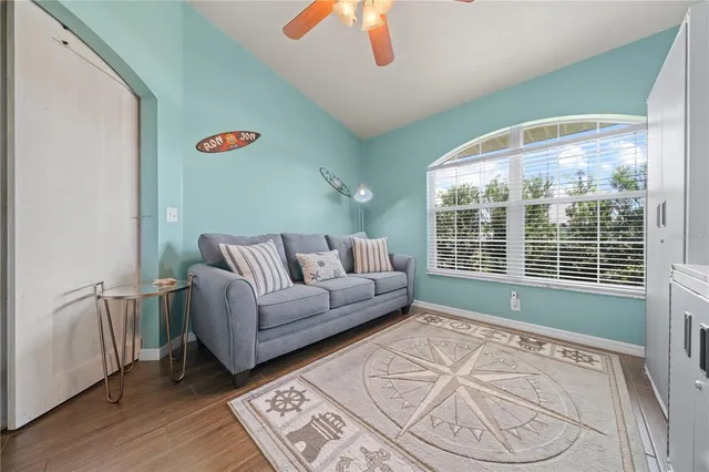 a living room with furniture and a large window