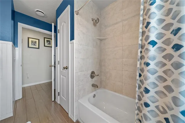 a bathroom with a bathtub and a shower