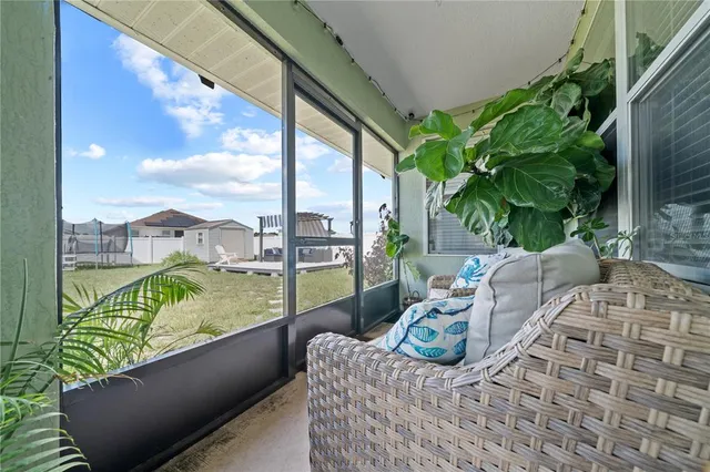 a view of balcony with couch and chairs