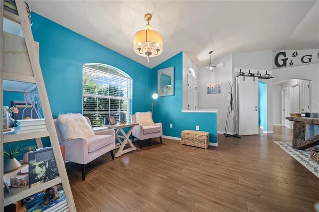 a living room with furniture and a large window