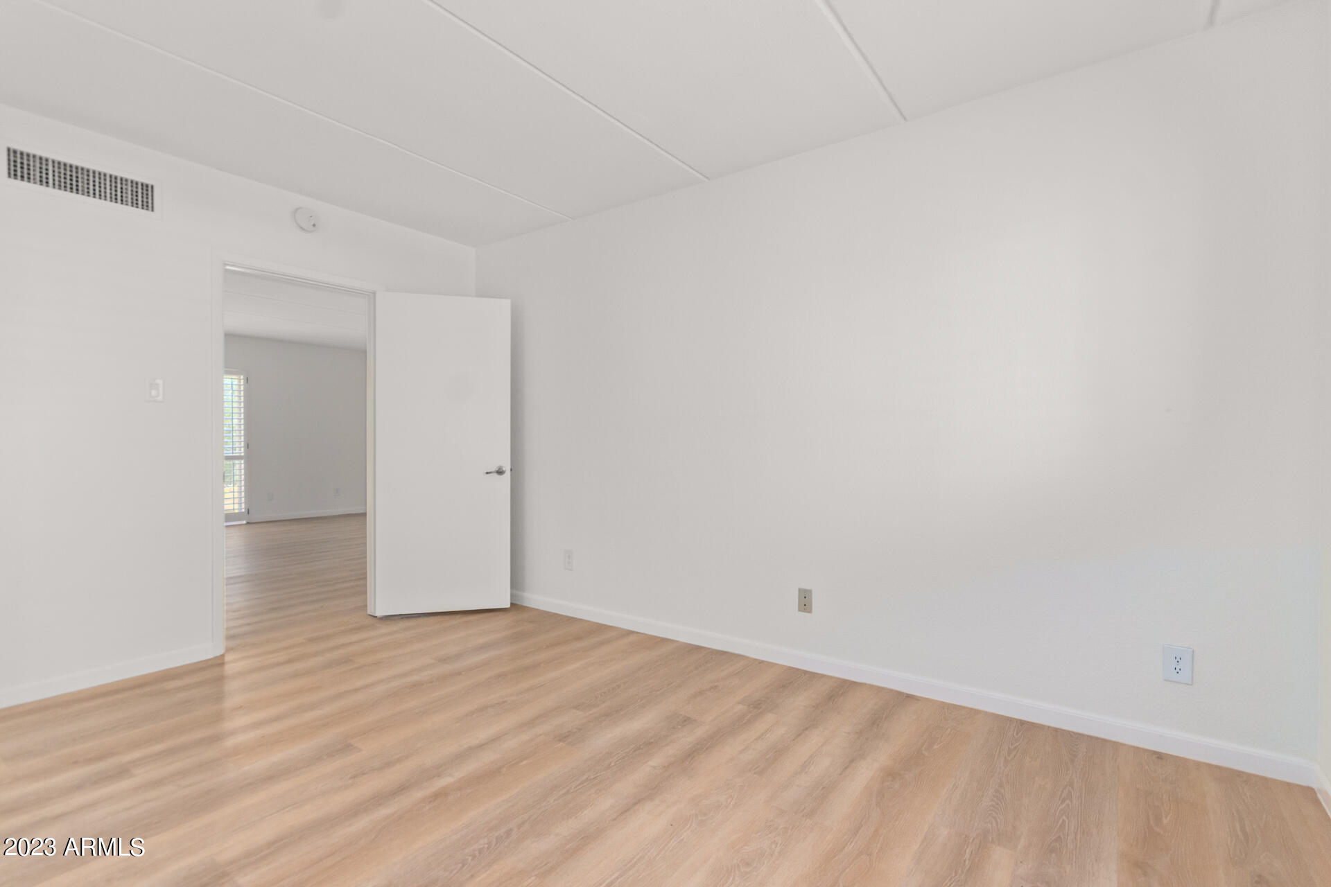1024 East Osborn Road, Unit B Phoenix, AZ 85014 - Photo 14 of 21 a view of an empty room with wooden floor