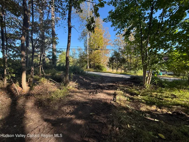 a view of wooden fence and trees