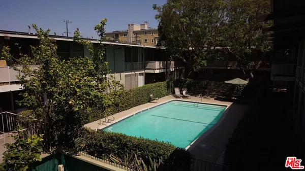 a view of a backyard with sitting area