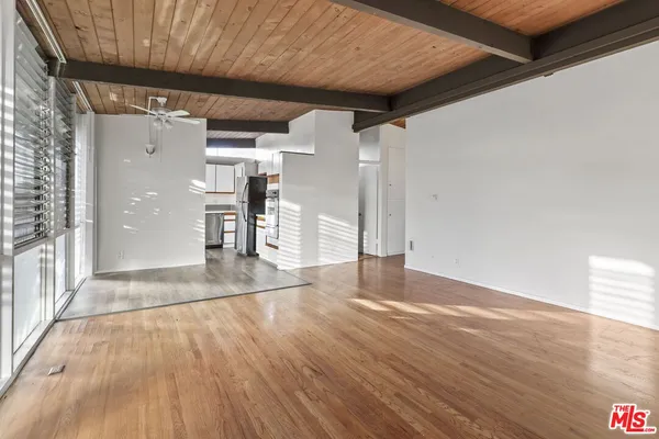 a view of a livingroom with wooden floor